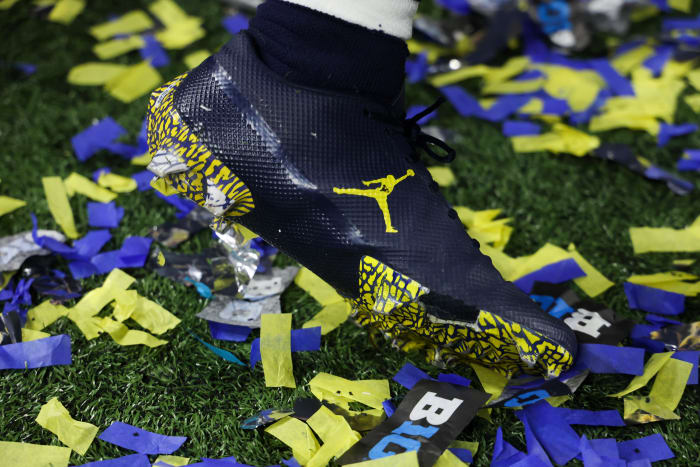 A Michigan Wolverines' football players' navy Jordan Brand cleats.